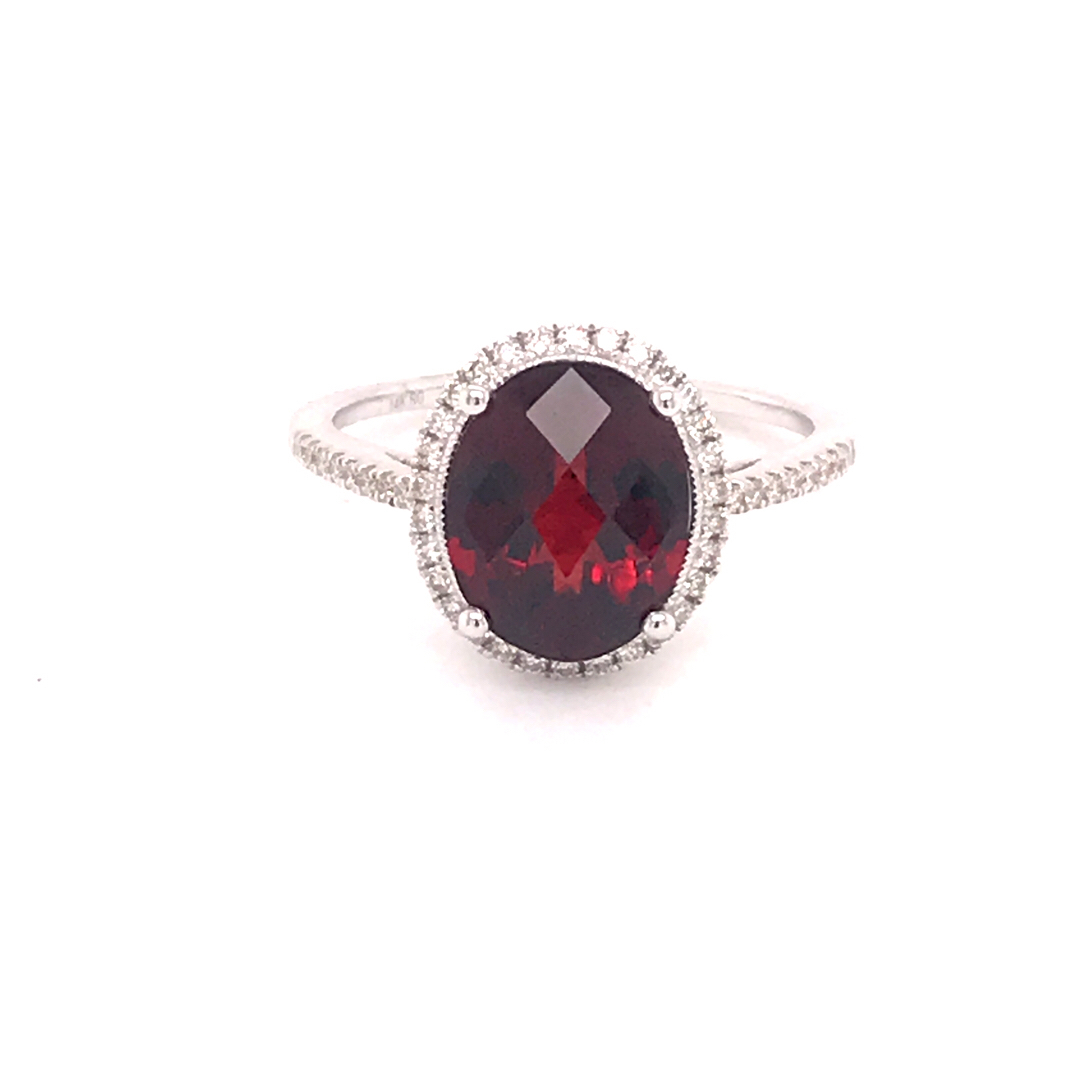 Oval Garnet with Diamond Halo and Sides : Professional Jewelers